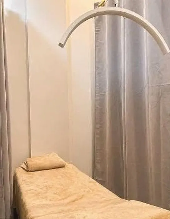 Curtained treatment bed