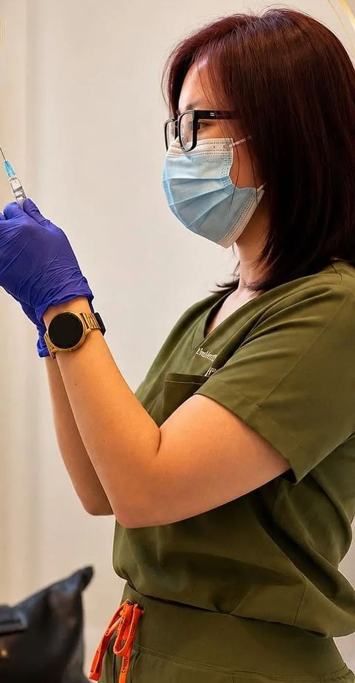 A ShapeLab clinician preparing an injectable treatment